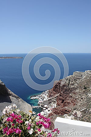 Mountains,turquoise sea and pink flowers