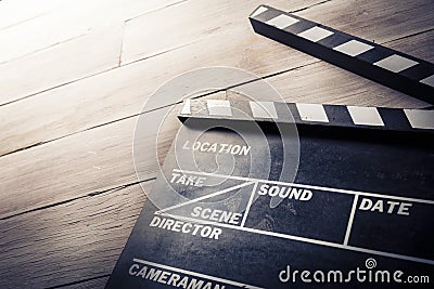 Movie slate on a wooden background