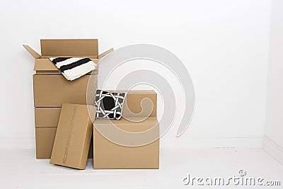 Moving boxes with blanket and pillow