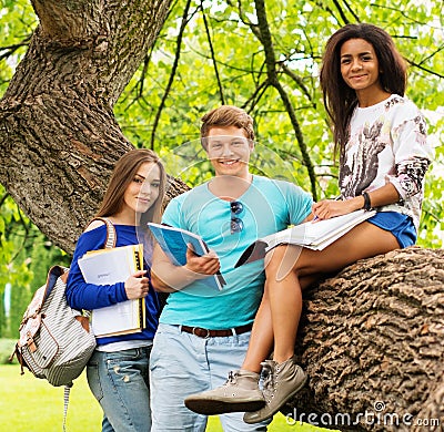 Multi ethnic students in a city park