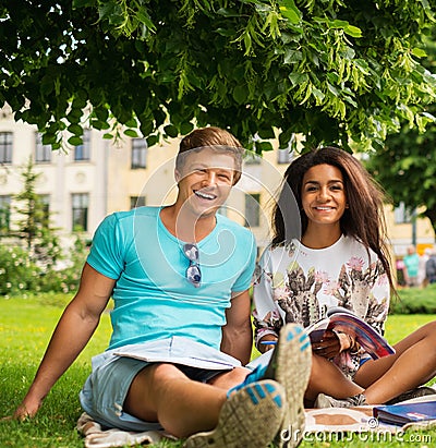 Multi ethnic students couple in a park