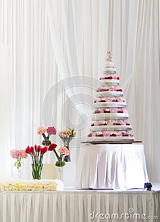 Multi Tier Big Wedding Cake decorated with fresh flowers
