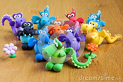Multicolored handmade modelling clay dragons