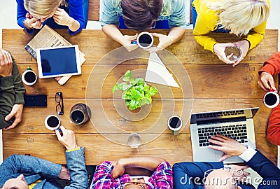 Multiethnic People with Start up Business Talking in a Cafe