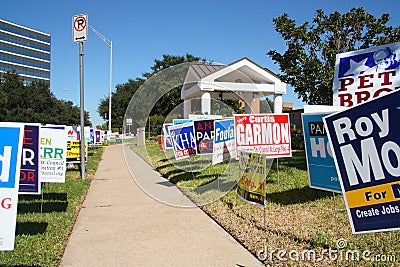 Multiple campaign signs at voting location