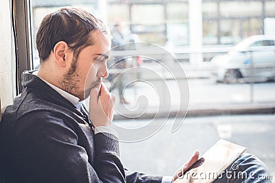 Multitasking man using tablet, laptop and cellhpone