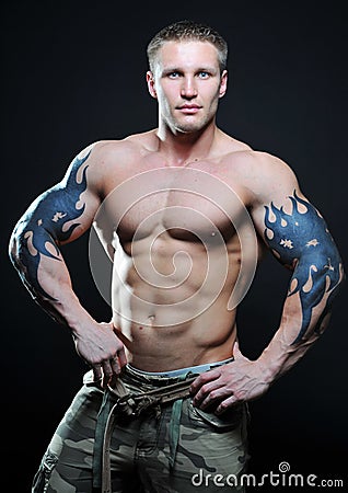 Muscled model with tattoo