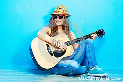 Music woman portrait with guitar.