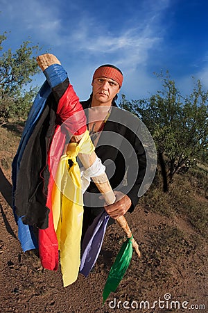 Native American man with colorful flags