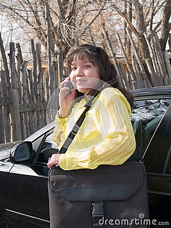 Native American woman talking on a cell phone