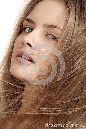 Natural look. Girl with flying blond hair