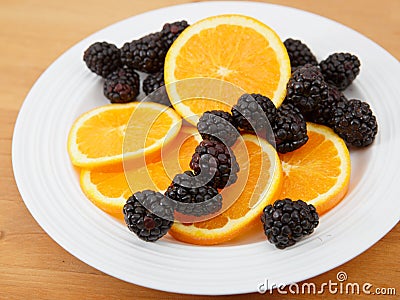 Navel orange and fresh blackberries