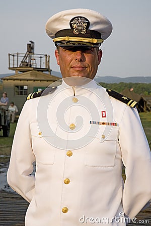 Navy Officer smiling in dress white uniform