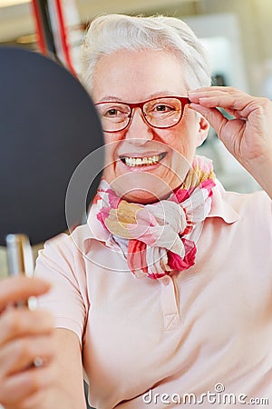 Nearsighted senior woman with new