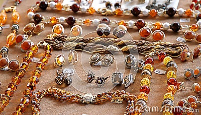 Necklaces, earrings, and precious gems made with precious amber