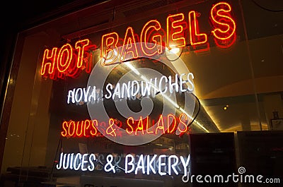 Neon sign on deli store window