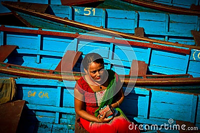 A Nepali woman sitting in the boats of Phewa Lake, Pokhara, Nepal