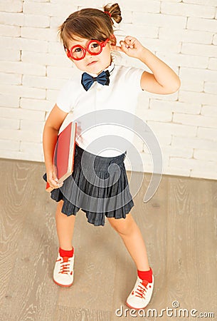 Nerd girl holding a red book