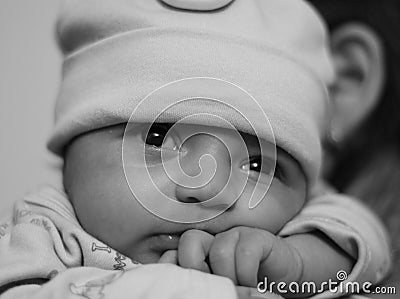 New born asian baby girl on her mother s shoulder