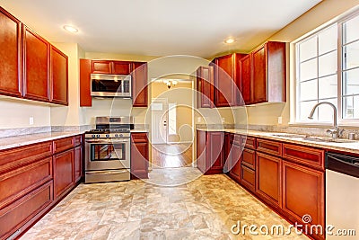 New cherry wood kitchen with stinless steal appliances.