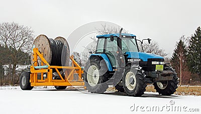 New Holland 8160 Tractor with Power Cable on Trailer