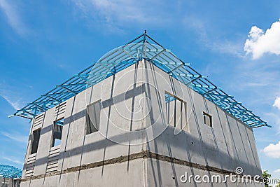 New home under construction using steel frames against cloudy sk