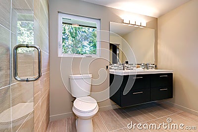 New simple modern bathroom with double sinks and natural ceramic tile.