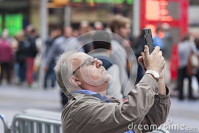 New York City -October 10: Mature Man at Times Square Standing W