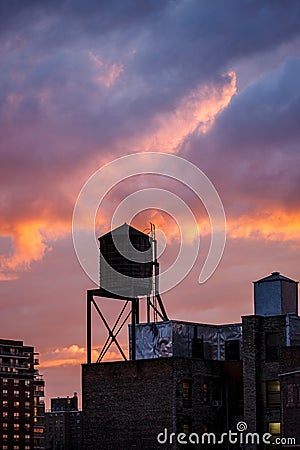 New York City water tower at sunset