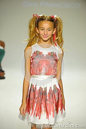 NEW YORK, NY - OCTOBER 18: A model walks the runway during the Alivia Simone preview at petite PARADE Kids Fashion Week