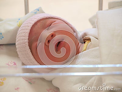 Newborn baby on the bed
