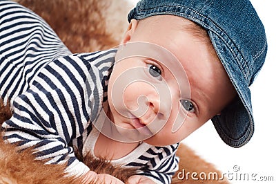 Newborn baby in denim cap