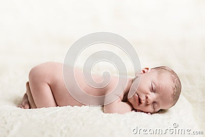 Newborn Baby Male Sleeping Peacefully on Blanket