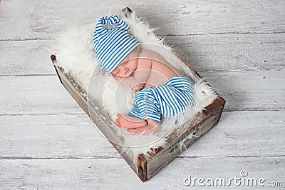 Sleeping Newborn Baby Wearing Pajamas