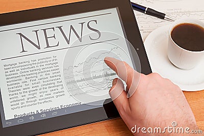 News on digital tablet.