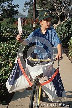Newspaper boy on delivery papers
