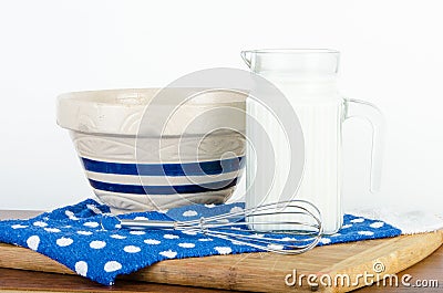 Nice pitcher of milk with bowl and whisk