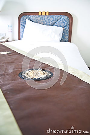 Night scene in hotel room: prepared fresh bed