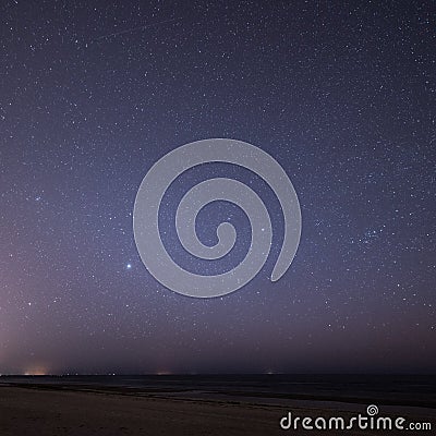 Night sky with stars on the beach. space view.