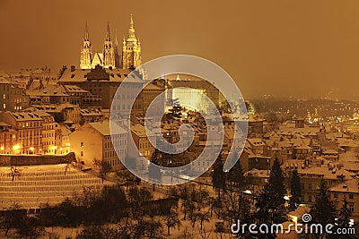 Night snowy Prague City withgothic Castle