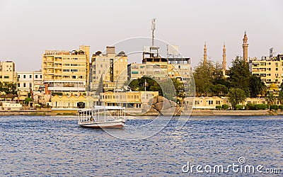 Nile River commercial life by Aswan City with Boats