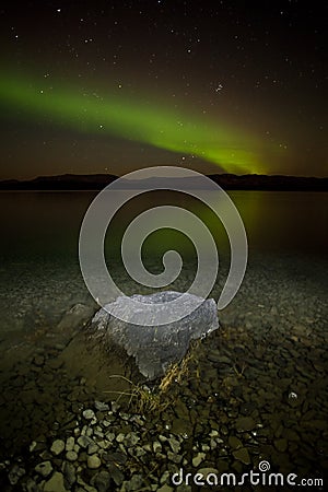 Northern lights mirrored on lake