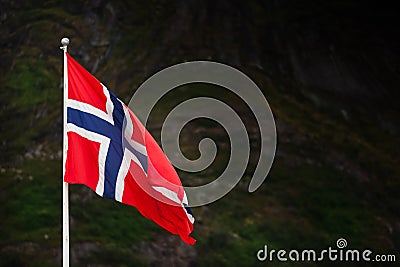 Norwegian flag bevore mountains