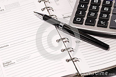 Note pad with pen and calculator