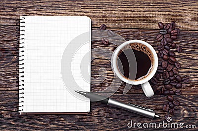 Notepad and cup of coffee