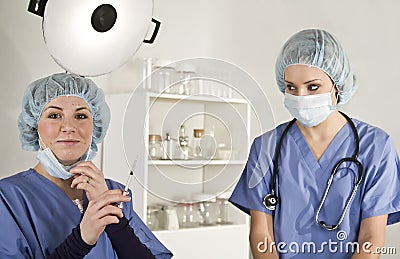 Nurse and Doctor in surgery with syringe