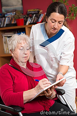 Nurse is helping a old woman