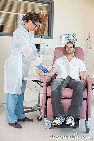 Nurse Injecting Cancer Patient During Intravenous
