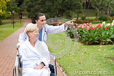 Nurse taking patient for a walk