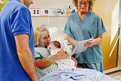 Nurse using tablet to give instructions to parents